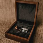 Creative design of square shaped box with thumb drive for gift on rough brown background