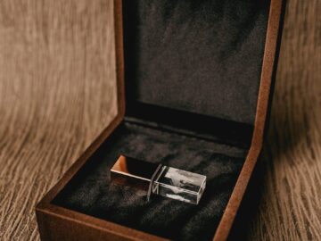 Creative design of square shaped box with thumb drive for gift on rough brown background