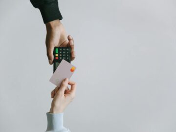 Modern contactless payment using a card and terminal, highlighting the ease of digital transactions.