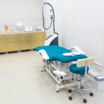 Clean and modern medical examination room with equipment ready for use.