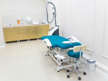 Clean and modern medical examination room with equipment ready for use.
