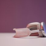 Contemporary close-up of stylish headphones on a pastel background, perfect for tech themes.