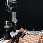 Robotic arm making a strategic move on a chessboard, showcasing AI in games.