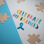 Colorful typography and puzzle pieces celebrate diversity and uniqueness.