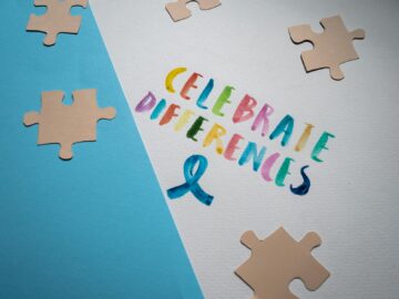 Colorful typography and puzzle pieces celebrate diversity and uniqueness.