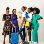 A group of five women showcasing diverse professions in a studio setting with a white background.