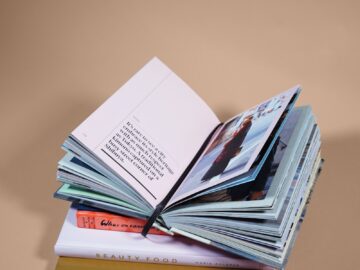 open book on top of several stacked books