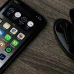 black iphone 5 on brown wooden table