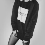 grayscale woman in long-sleeved shirt