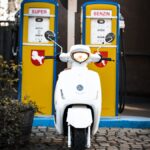 white and blue motor scooter