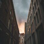 low angle photography of high rise buildings under cloudy sky during daytime