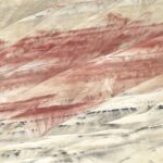 a large group of hills with a sky background