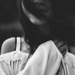 woman wearing cold shoulder blouse