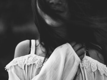 woman wearing cold shoulder blouse