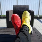 pair of red-and-yellow sneakers