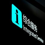 a lit up sign in a dark room