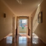 a hallway with a glass door