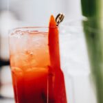 clear drinking glass with orange juice