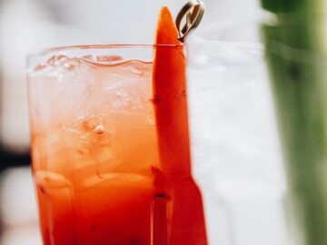 clear drinking glass with orange juice