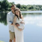 man holding woman tummy