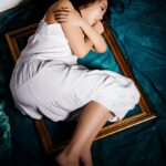 woman in white dress laying photo frame