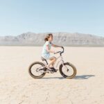 girl riding bicycle outdoor during daytime