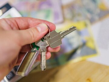 A person holding a bunch of keys in their hand