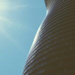 a tall building with a sky background