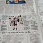 a newspaper with a picture of a man on it