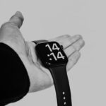 a hand holding a camera