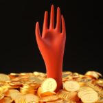 a pile of gold coins with a red hand sticking out of it