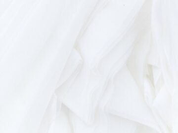 white textile in close up photography