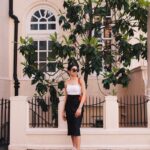 woman standing in front of fence