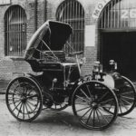 classic black automobile near building