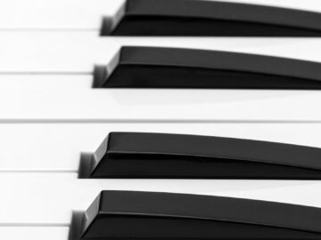 Detailed close-up of piano keys showcasing the contrast between black and white keys.