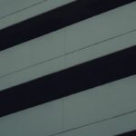 Minimalist architectural detail with dark and light contrasts, showcasing modern urban design.