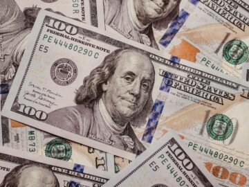 High-resolution image displaying a variety of US dollar banknotes in focus, symbolizing finance.