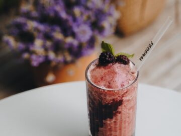 Delicious blackberry mint frozen drink with berry garnish, perfect for summer refreshment.