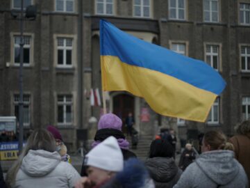 People gather in Wałbrzych, Poland, waving the Ukrainian flag in a show of solidarity.