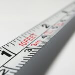 Detailed close-up of a measuring tape indicating measurements in feet and meters.