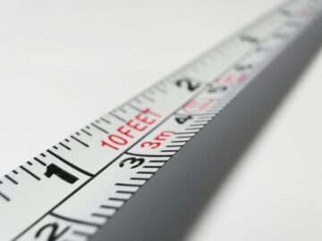 Detailed close-up of a measuring tape indicating measurements in feet and meters.