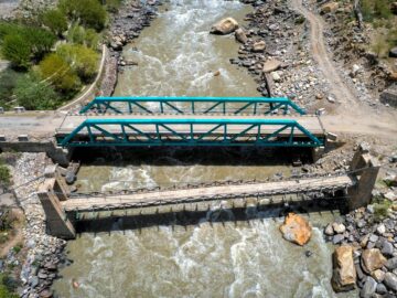 Aerial view of two bridges over the turbulent Zanskar River in India.