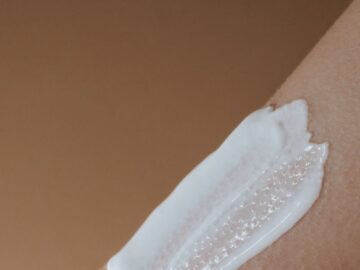 A detailed view of moisturizing cream applied on smooth human skin.