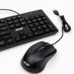 Close-up of a black Acer keyboard and mouse set against a white background.