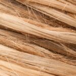 High-resolution close-up of intertwined natural fibers, showcasing rough and textured patterns.