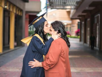 A touching moment of a graduate kissing her mother in Guayaquil, Ecuador.