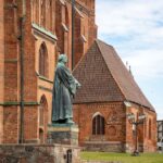 Statue of Martin Luther in front of a historic church, symbolizing the Reformation.