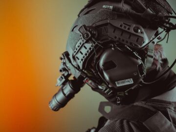 Close-up of a tactical helmet equipped with night vision gear, emphasizing technology.
