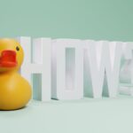 A playful rubber duck next to the word HOW against a green background.