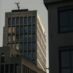 View of modern high-rise buildings in Frankfurt during sunset, showcasing urban architecture.